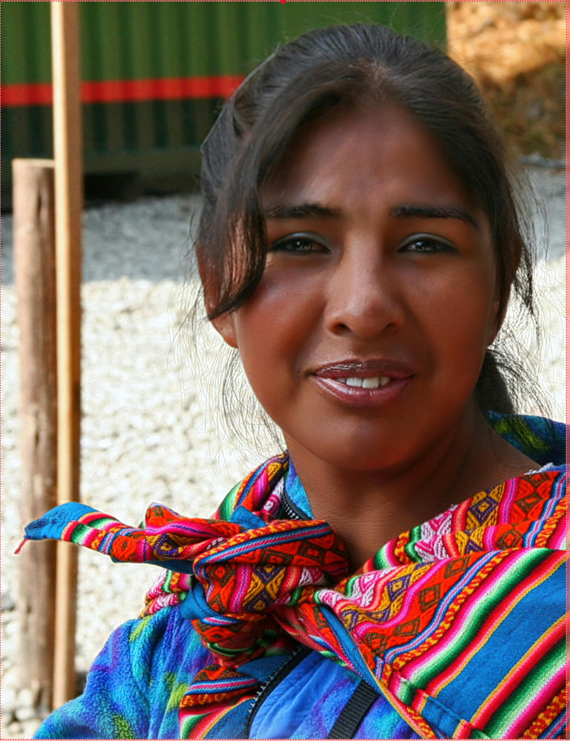 A woman in traditional colorful dress representing indigenous wisdom