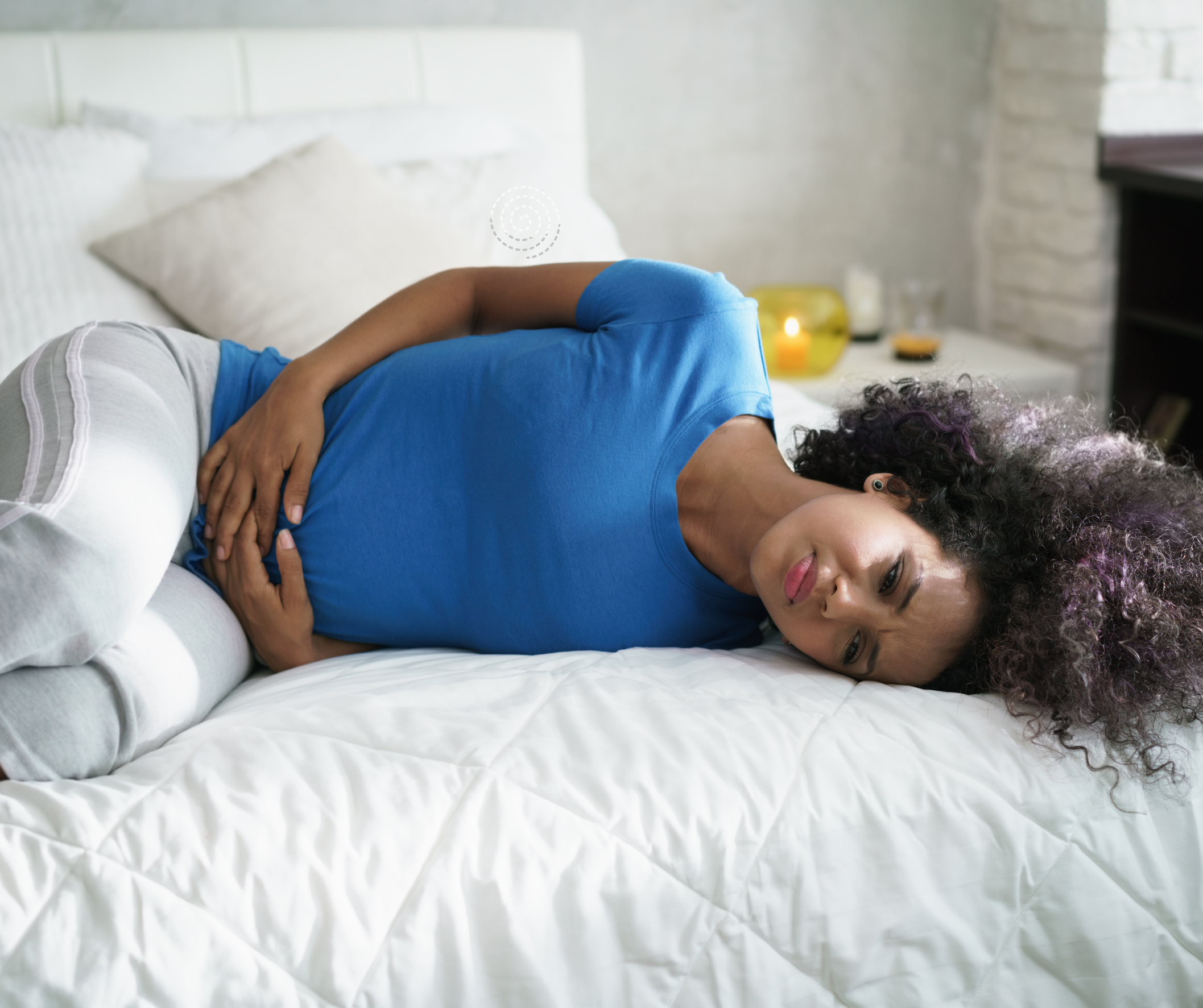 Woman experiencing menstrual discomfort during perimenopause